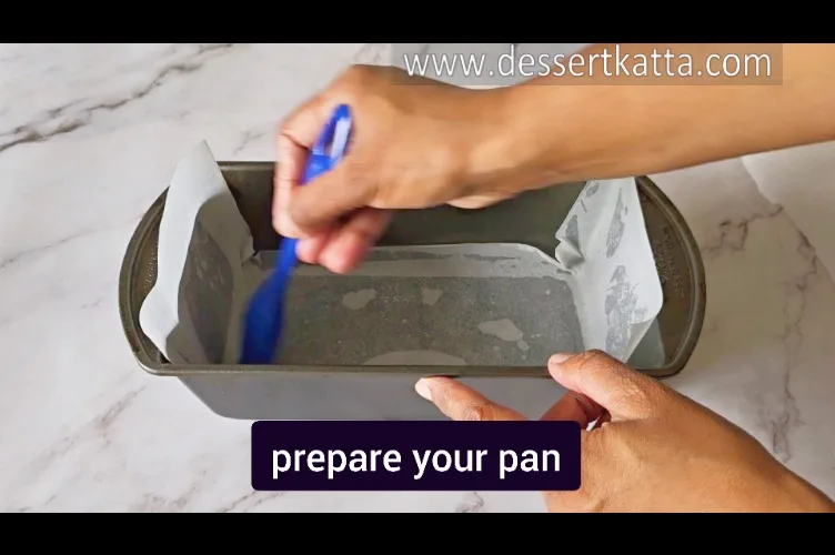 preparing the loaf pan for Starbucks red velvet loaf cake