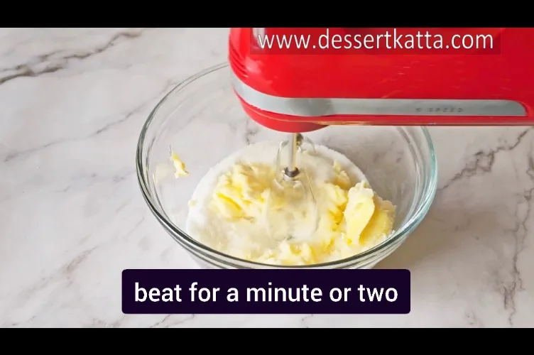 beating butter and sugar with hand beater