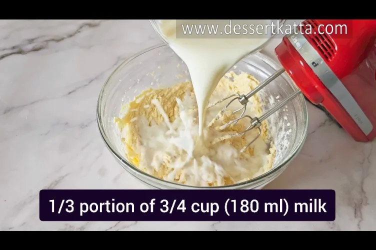 adding milk to the red velvet loaf cake batter