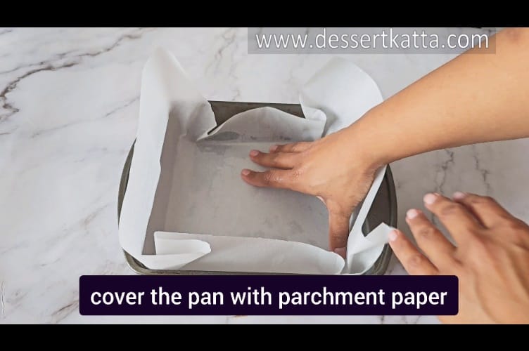 preparing 9 inch square pan by covering it with parchment paper