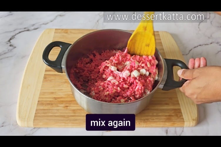 mixing rice krispy treat mixture after adding mini marshmallows