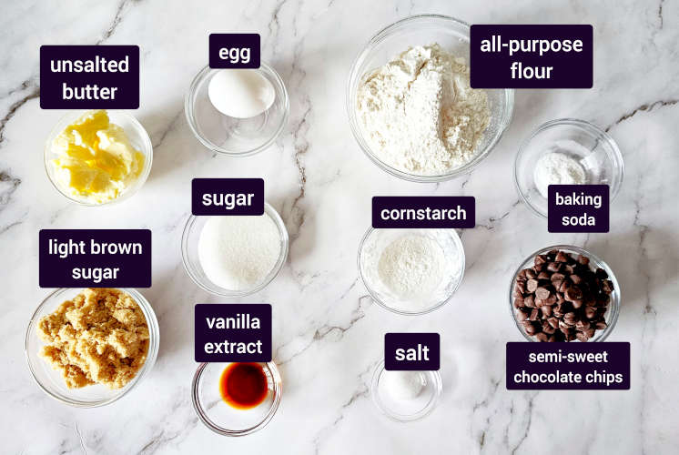chocolate chip cookie bar ingredients placed on marble surface