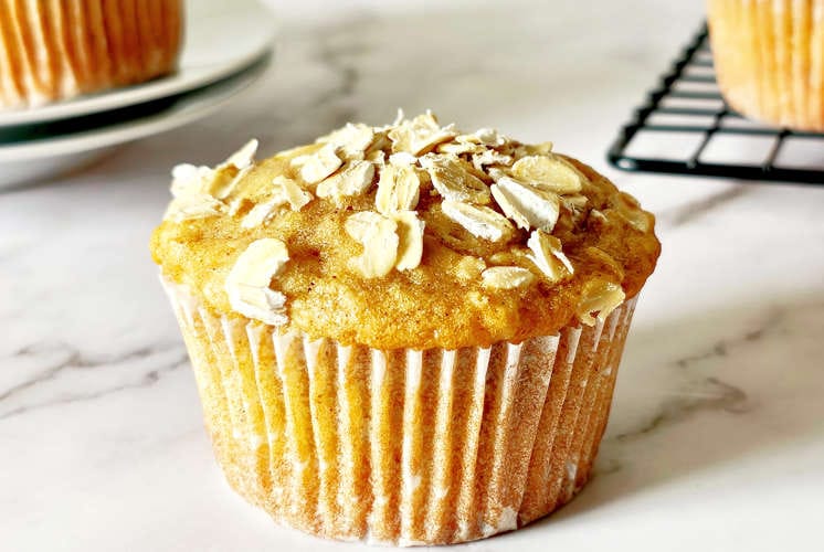 front shot of healthy muffins with few more muffins in the background