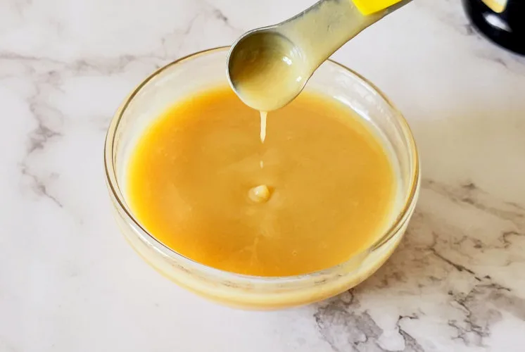 vanilla sauce texture showing with a spoon